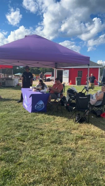 SOS Plumbing & Heating tent at a Rhode Island community event