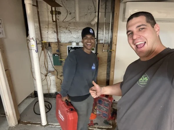 SOS crew after finishing a plumbing job at a Rhode Island property