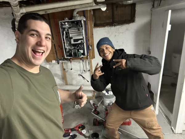 SOS technicians on site during a plumbing and heating job in Rhode Island