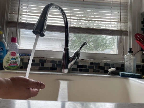Newly installed kitchen faucet running clear water after an SOS fixture installation