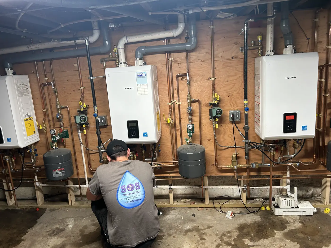 SOS technicians completing a Navien high-efficiency heating installation in Rhode Island