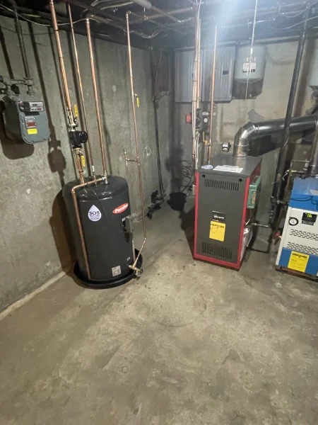 New water heater and boiler installed side by side by SOS in a Rhode Island basement